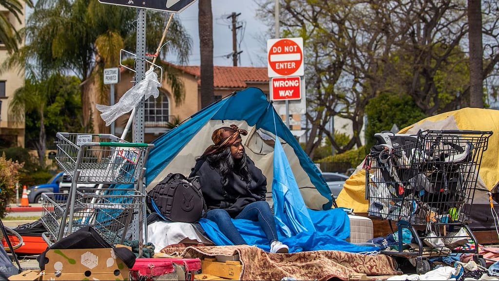 homelessness-california-gty-lv-230620-2_1687288459168_hpMain_16x9 Homeless woman sits at her makeshift home