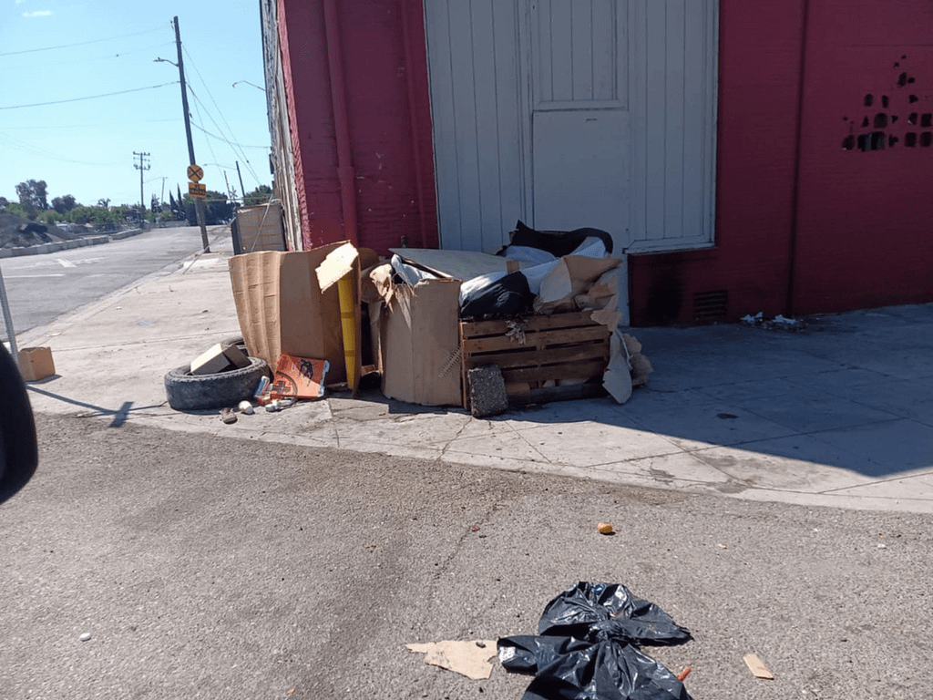 defb2fbd-4615-4462-be6e-e6f861ee39c5 A picture of a makeshift shelter, made behind a business door