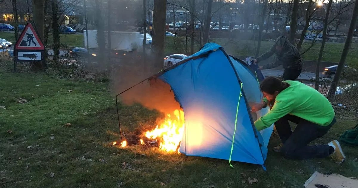 A fire destroying a homeless person's tent.