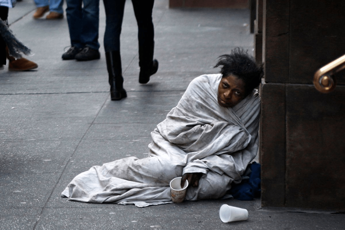 Homeless black man on the ground example of 5150 5